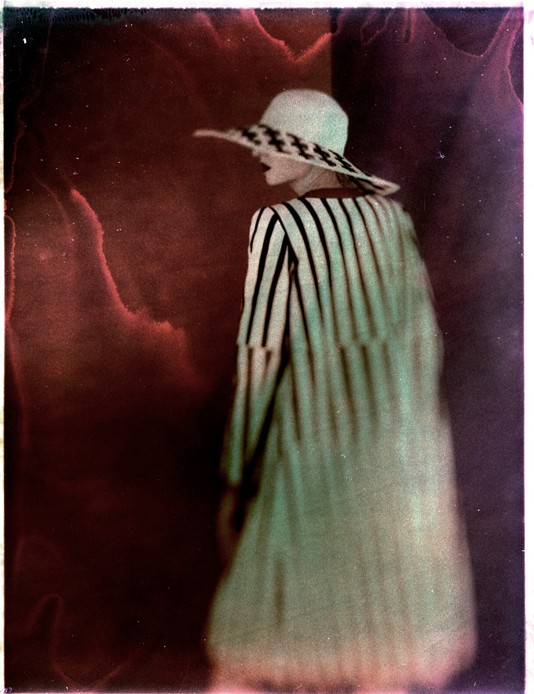 A fashion figure in a bleached and reclaimed instant-film study.